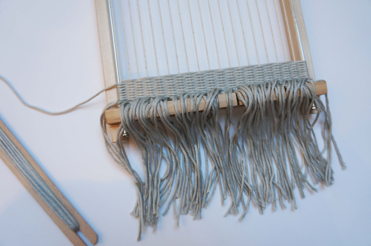 Weaving a tapestry with a loom